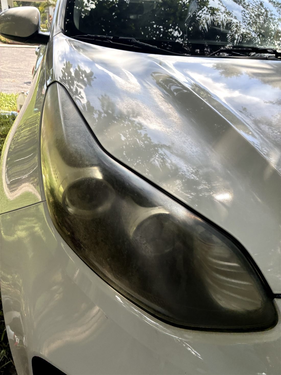 Hazy, oxidized headlight lens before restoration